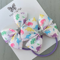 Elastic Bow Piggy Pair - Rainbow Dinosaurs